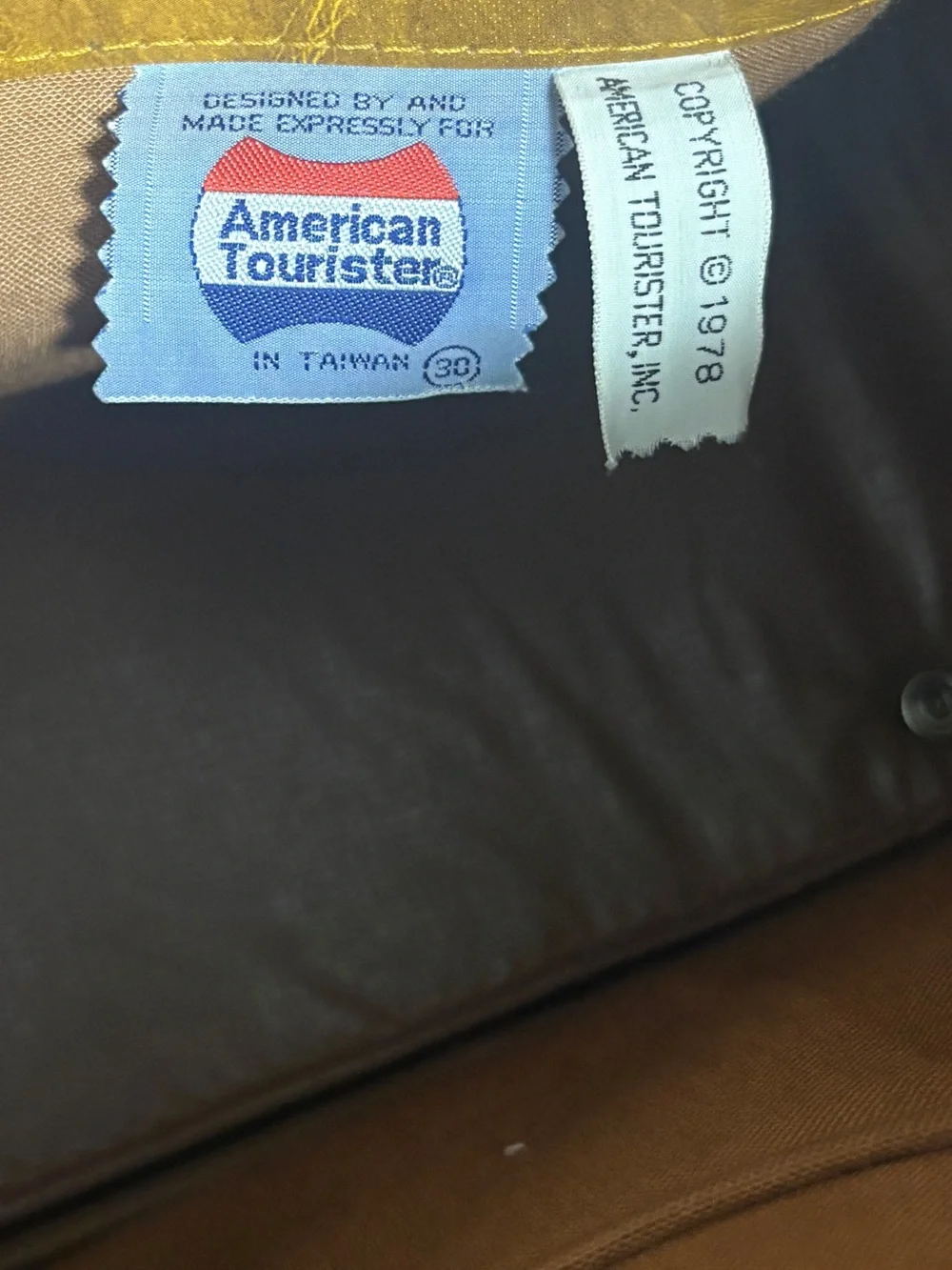 American tourister brown carry on bag